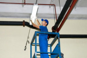 Commercial electrical contractor working on LED retrofit